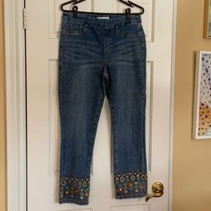 Tribal embellished blue jeans.